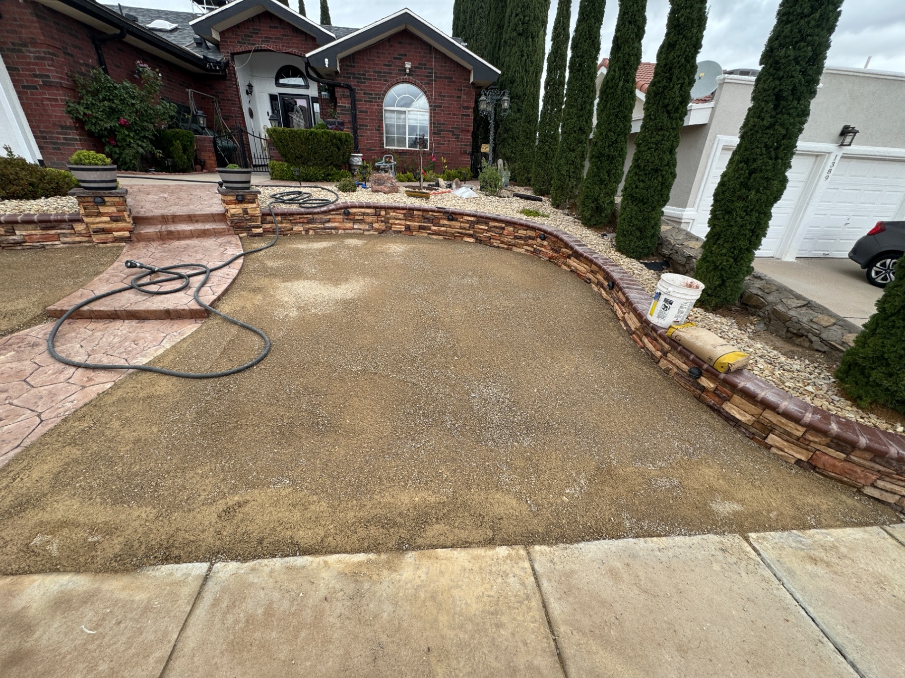 Prepared decomposed granite sub-base at a James Dudley Dr home in El Paso — ready for artificial turf install